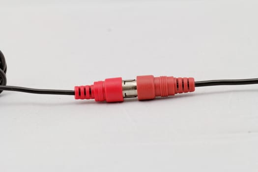 correct conection between left - right audio RCA cable on a white background (red white)