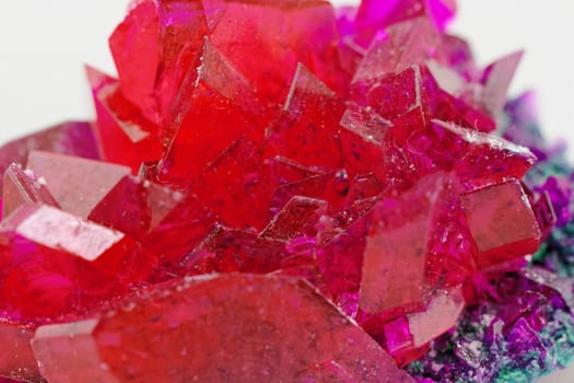 close up of crystals in ruby color on white background (red crystal)