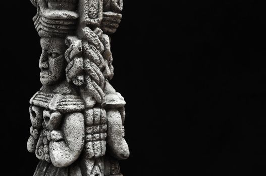 One Ancient Mayan Statue on a Black Background