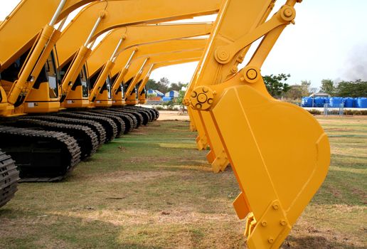 Lineup of Construction Vehicles At Construction Site