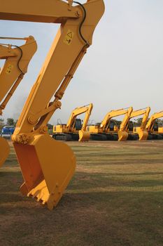 Lineup of Construction Vehicles At Construction Site