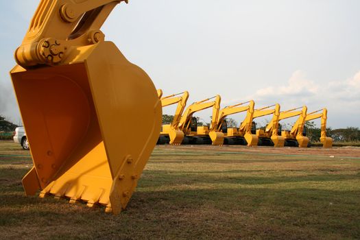 Lineup of Construction Vehicles At Construction Site