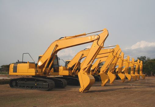 Lineup of Construction Vehicles At Construction Site