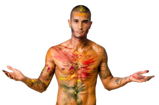 Attractive young man shirtless, skin painted all over with bright Honi colors
