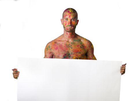 Handsome young man with skin all painted with Honi colors holding big white blank sign or board