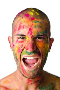 Headshot of young man screaming with face's skin all painted with bright colors, isolated on white