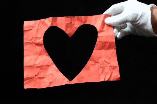 Heart And an Hand on a Black Background