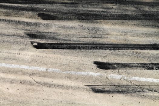 Background with tire marks on road track