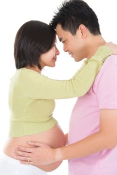 Asian pregnant couple face to face standing isolated on white background.