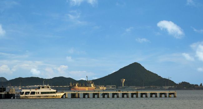 Ship in industrial port and sky landscape