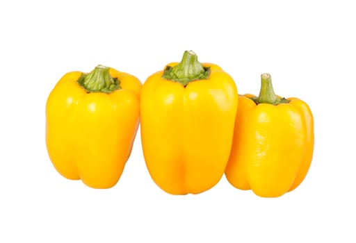 Three yellow bell peppers (Capsicum annuum) isolated against a white background