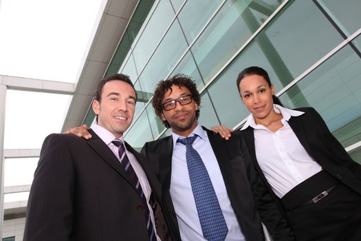 Business trio outside an office building