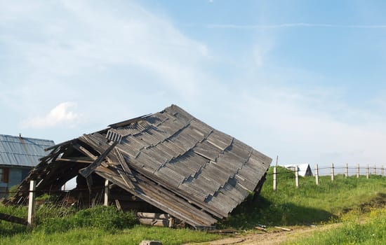 The old thrown house in village in the spring. 