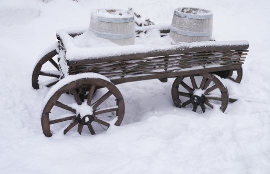 dray horse with barrels in the snow
