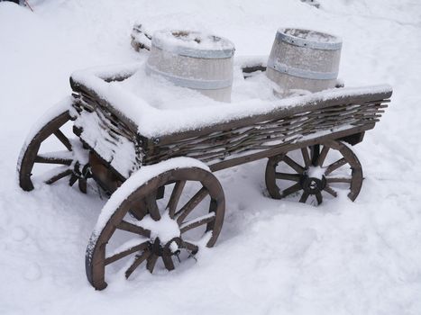 dray horse with barrels in the snow
