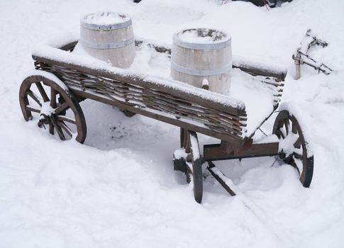 dray horse with barrels in the snow