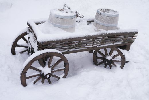 dray horse with barrels in the snow