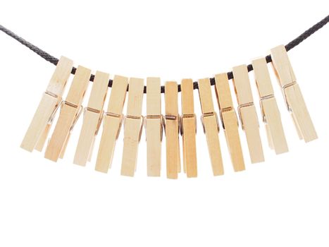 Clothespins and rope on a white background 