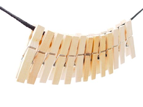 Clothespins and rope on a white background 