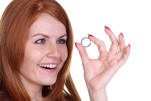 Young beautiful woman showing her engagement ring