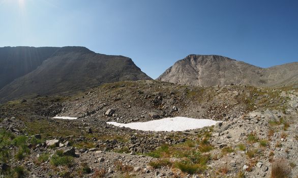 Snow in the mountains in summer