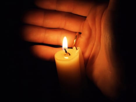 hand with candle