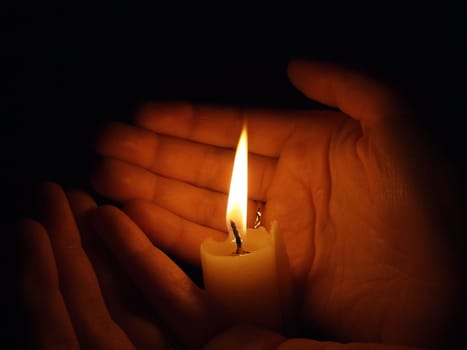 hand with candle