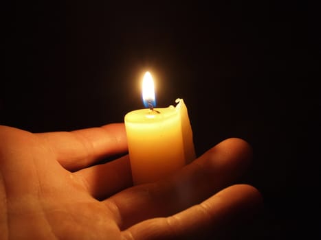 hand with candle