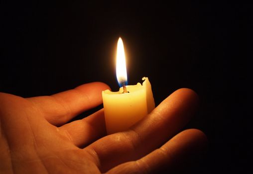 hand with candle