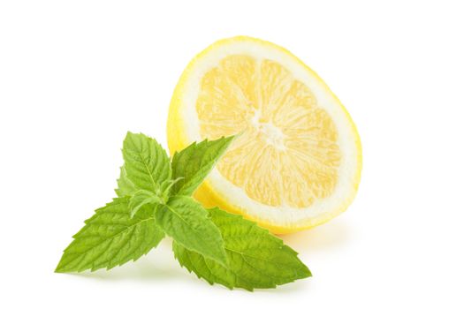 Lemon with mint leaves over white background