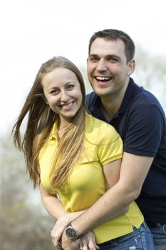 Portrait of love couple embracing outdoor