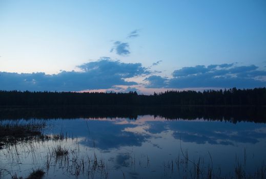 Decline on lake in a wood. Karelia, Russia 
