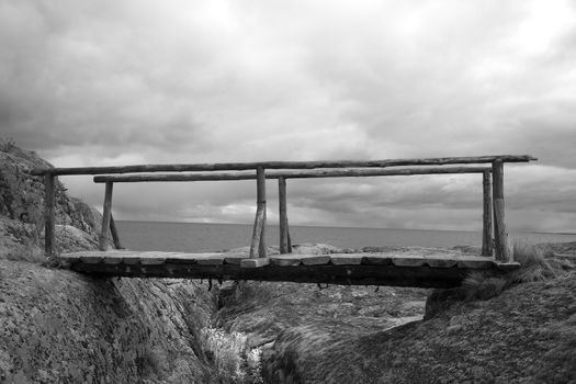 the ancient bridge among a severe landscape of the North