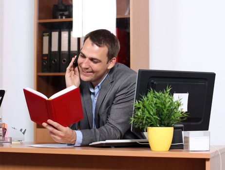 Smiling man talking on mobile phone