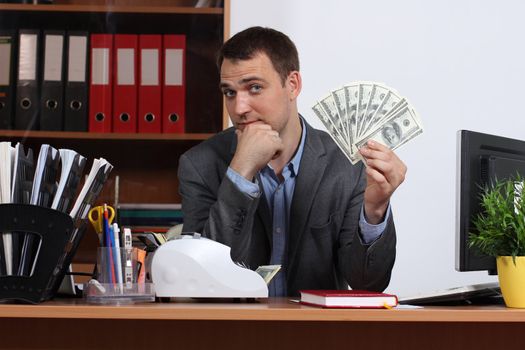 A young man with dollars in their hands