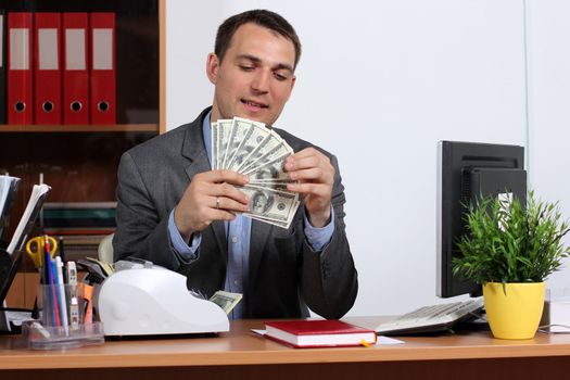 A young man with dollars in their hands