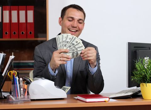 A young man with dollars in their hands