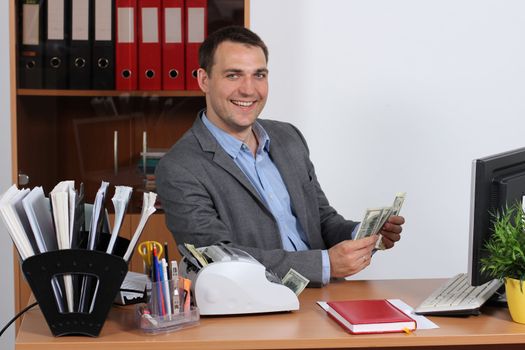 A young man with dollars in their hands