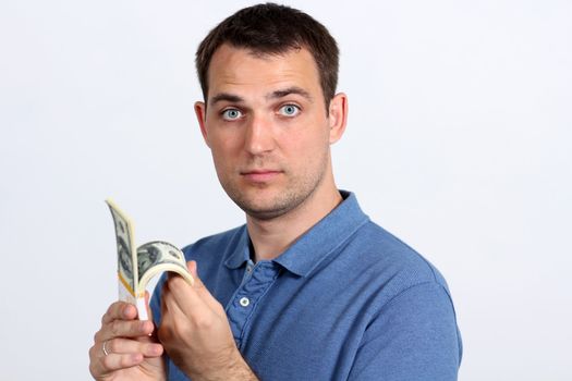 Man with money showing thumbs up