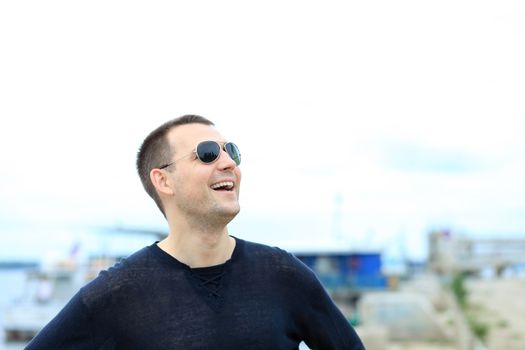 Portrait of young attractive man, outdoors