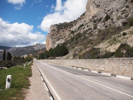 Road, forest and rock