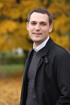 Portrait of young attractive man, outdoors