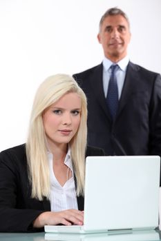 Man approaching from behind young blonde