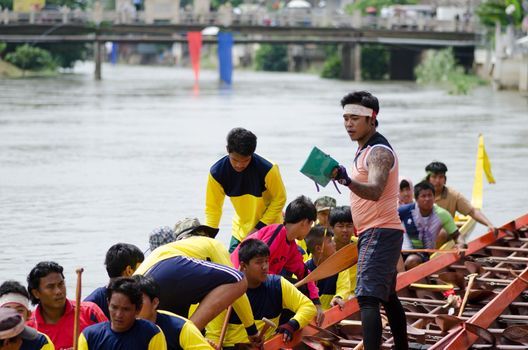 Petchaburi, THAILAND - October 7 : Participants in the Petchaburi Long Boat Competition 2012 on October 7, 2012 in The Petchaburi river ,Petchaburi Province, Thailand. 