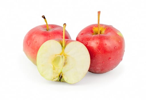 three fresh red apples. Isolated on white background. Close-up. Studio photography.