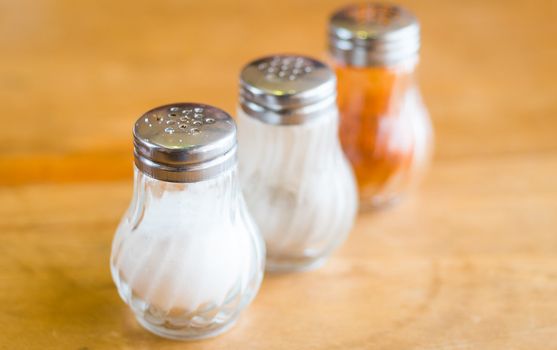 shaker glass bottle of salt and pepper for garnish food