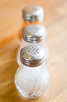 shaker glass bottle of salt and pepper for garnish food