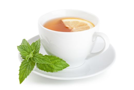 Tea with piece of lemon and mint on a plate over white background