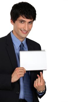 Businessman pointing to a blank notepad