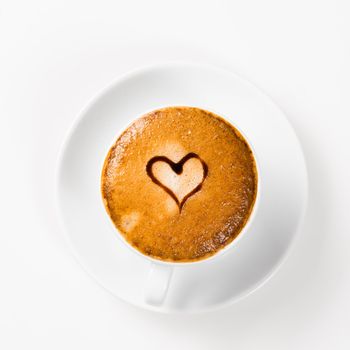 large cup of coffee with heart pattern on the foam